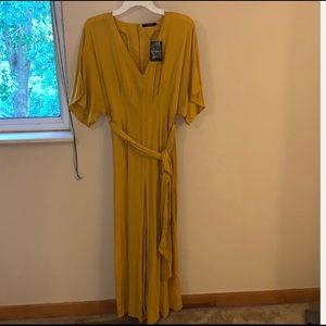 Mustard jumpsuit, new with slits a front
